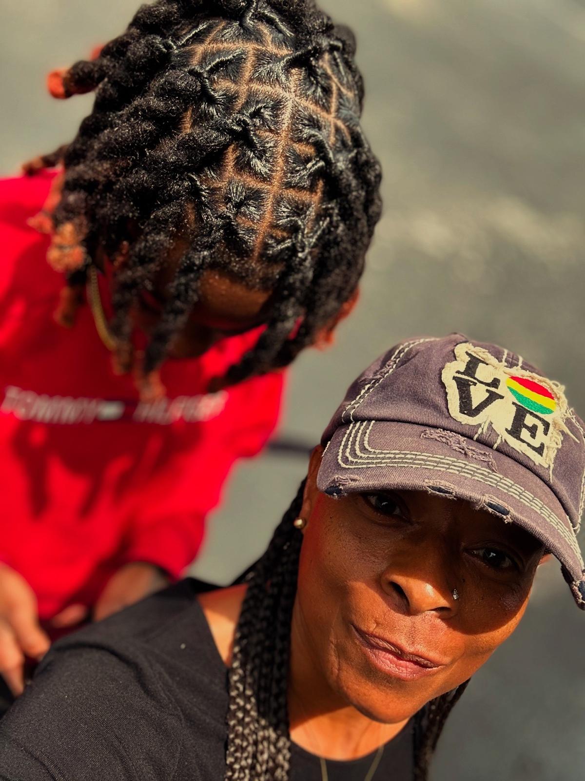Beautiful mother and child both with crown locs showing generational tradition